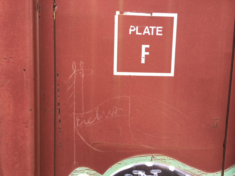 Wee creature of interperable (?) label on train.